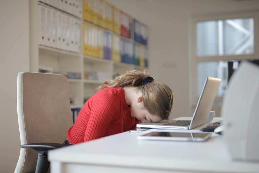 how to stay focused, overworked, tired girl in the office