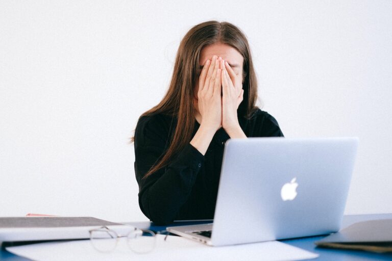 letting go of perfectionism, girl stressed behind the computer